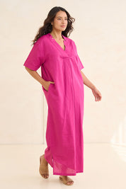 Model Tahnee wearing size 10 of the Linen Cotton V Neck Maxi Dress in colour Magenta (Pink), from the front, showing the whole outfit