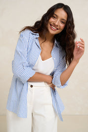 Model Tahnee wearing size 10 of the Cotton Oversized Stripe Boyfriend Shirt in colour Blue (Blue), from the front, showing the whole outfit