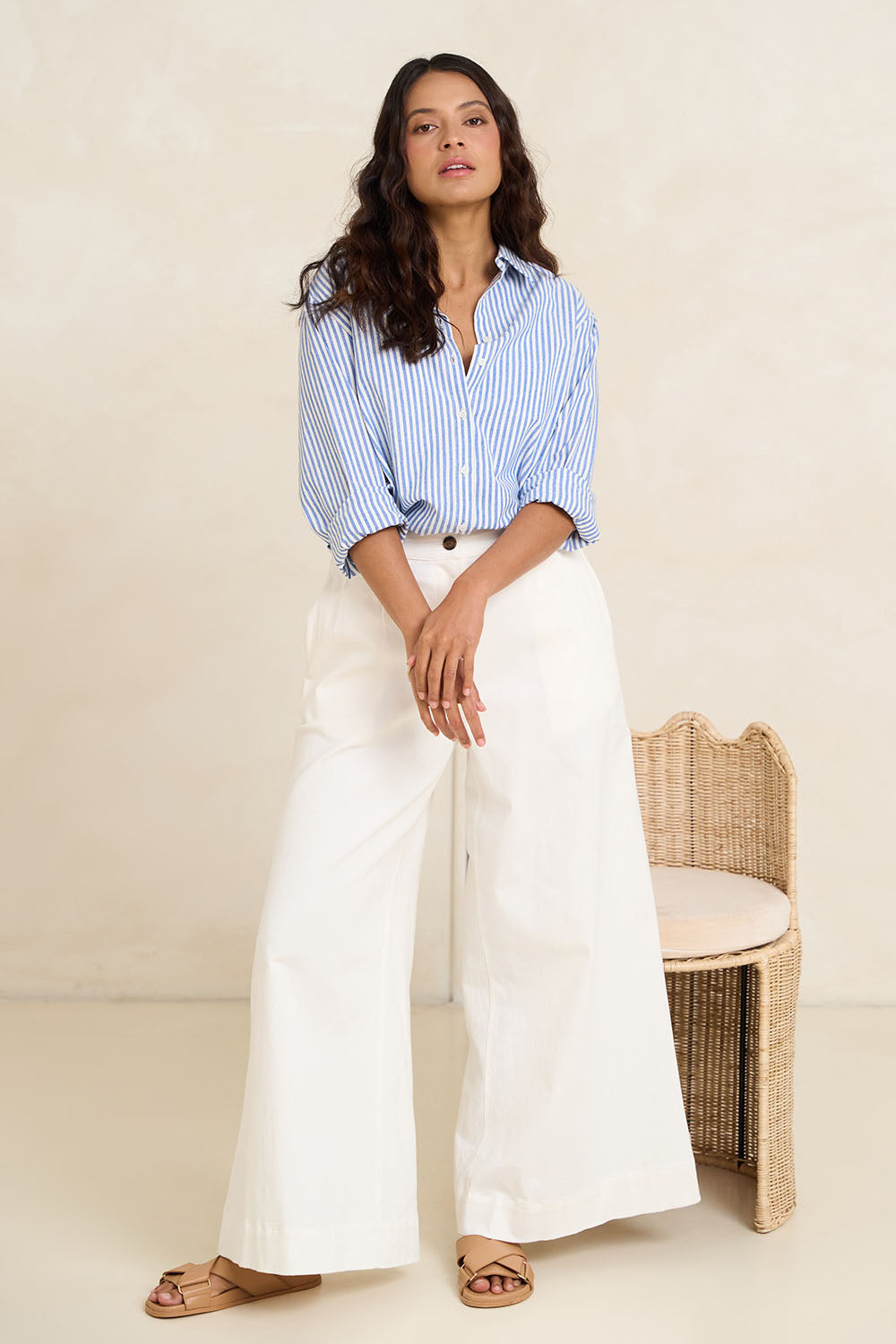 Model Tahnee wearing size 10 of the Cotton Oversized Stripe Boyfriend Shirt in colour Blue (Blue), from the front, showing the whole outfit