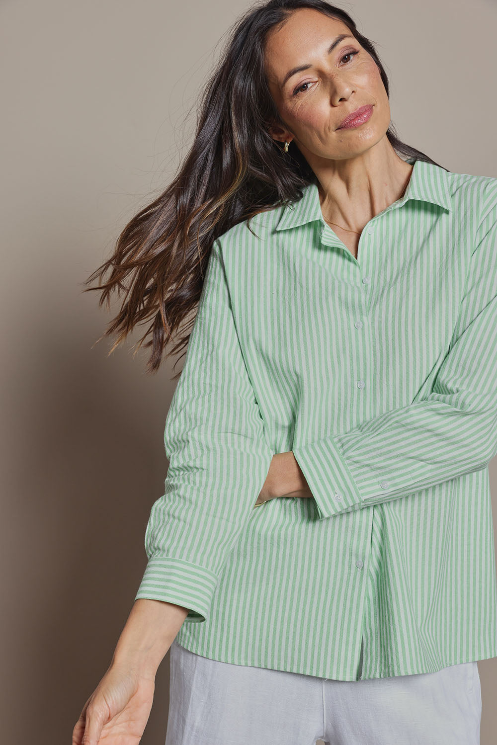 Model Amanda wearing size 10 of the Cotton Oversized Stripe Boyfriend Shirt in colour Green (Green), from the front, cropped image