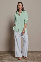 Model Amanda wearing size 10 of the Cotton Oversized Stripe Boyfriend Shirt in colour Green (Green), from the front, showing the whole outfit