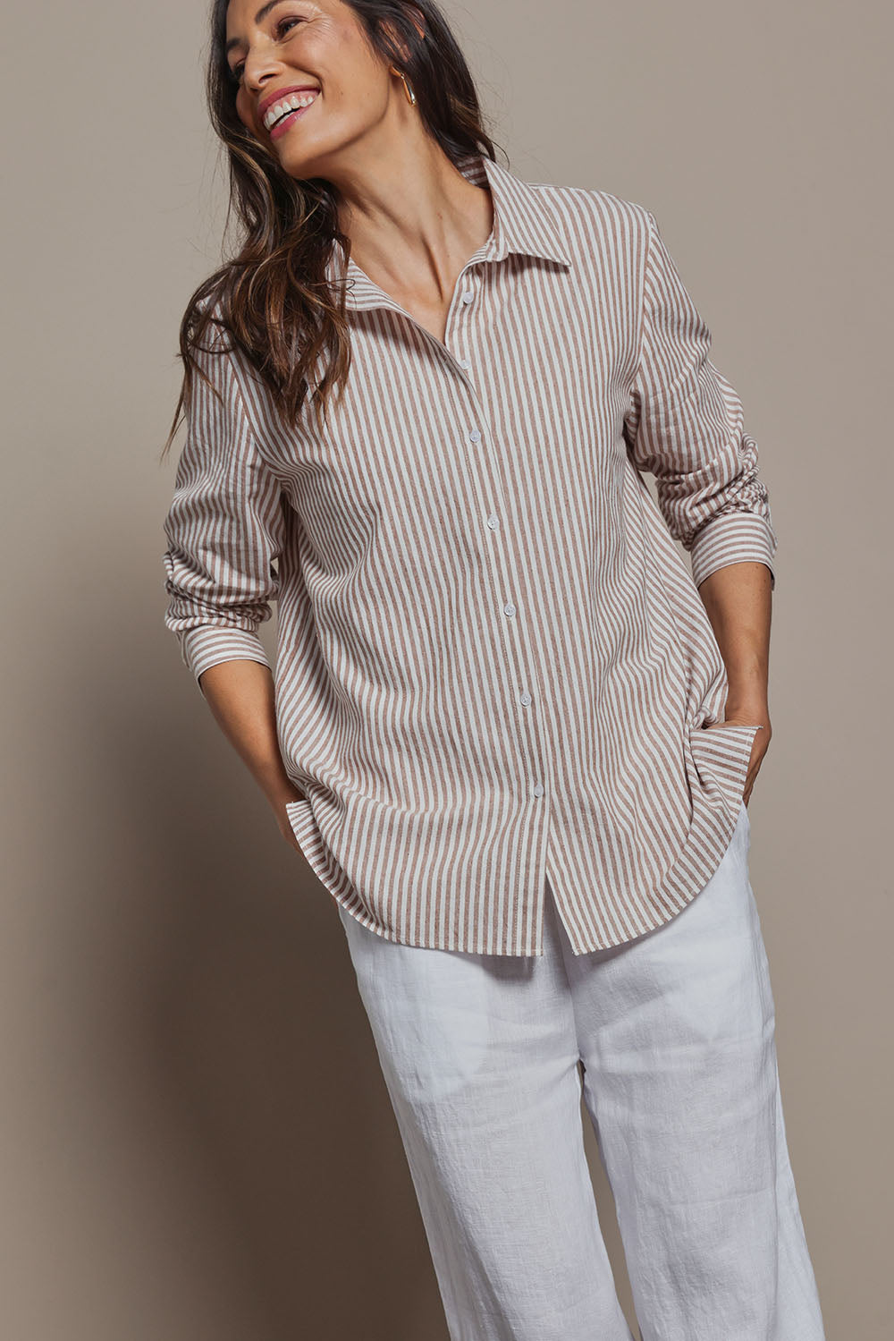 Model Amanda wearing size 10 of the Cotton Oversized Stripe Boyfriend Shirt in colour Latte, from the front, cropped image