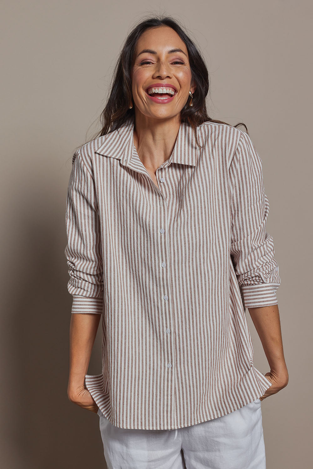 Model Amanda wearing size 10 of the Cotton Oversized Stripe Boyfriend Shirt in colour Latte, from the front, cropped image