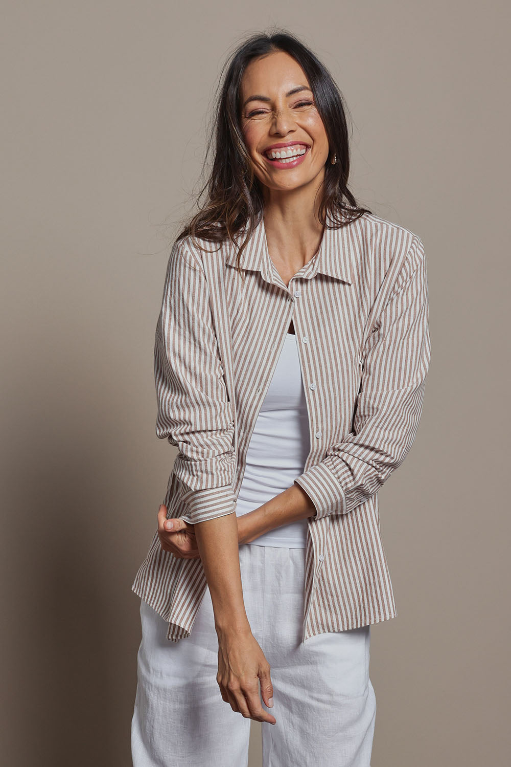 Model Amanda wearing size 10 of the Cotton Oversized Stripe Boyfriend Shirt in colour Latte, from the front, cropped image