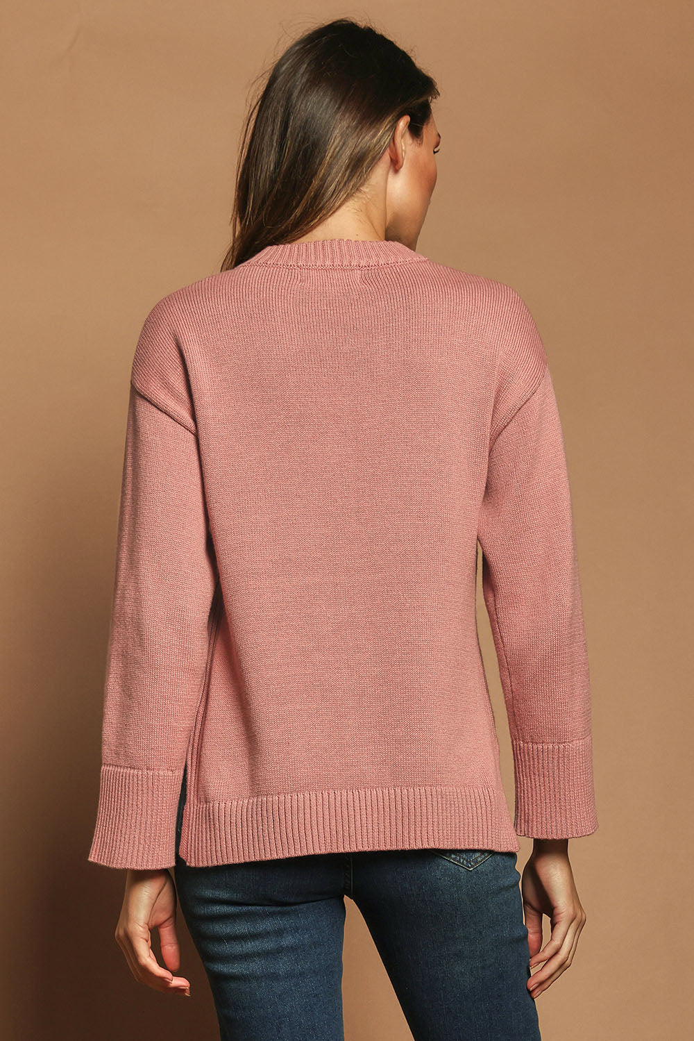 Model Madeline wearing size S of the Cotton Wool Cashmere Relaxed Jumper in colour Pink (Pink), from the back