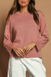 Model Madeline wearing size S of the Cotton Wool Cashmere Relaxed Jumper in colour Pink (Pink), from the front, cropped image