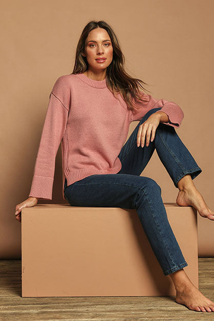 Model Madeline wearing size S of the Cotton Wool Cashmere Relaxed Jumper in colour Pink (Pink), from the front, showing the whole outfit