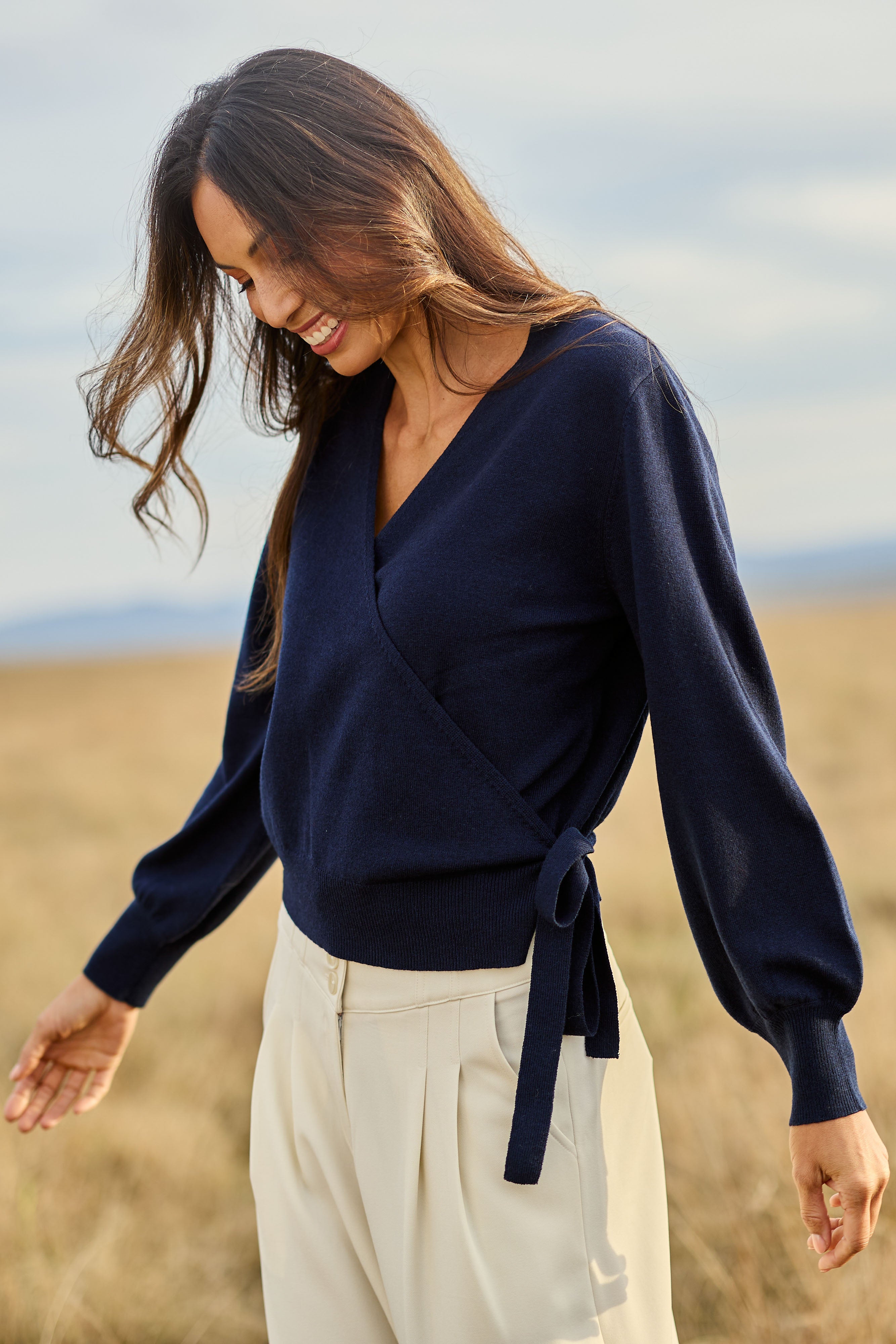 Model Amanda wearing size S of the Wool Cashmere Wrap Sweater in colour Peacoat (Blue), from the front, showing the whole outfit