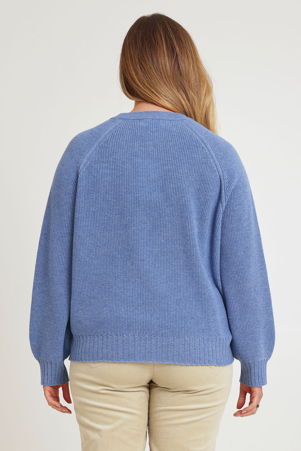 Model Chanel wearing size XL of the Wool Cashmere Sweater in colour Softblue (Blue), from the back