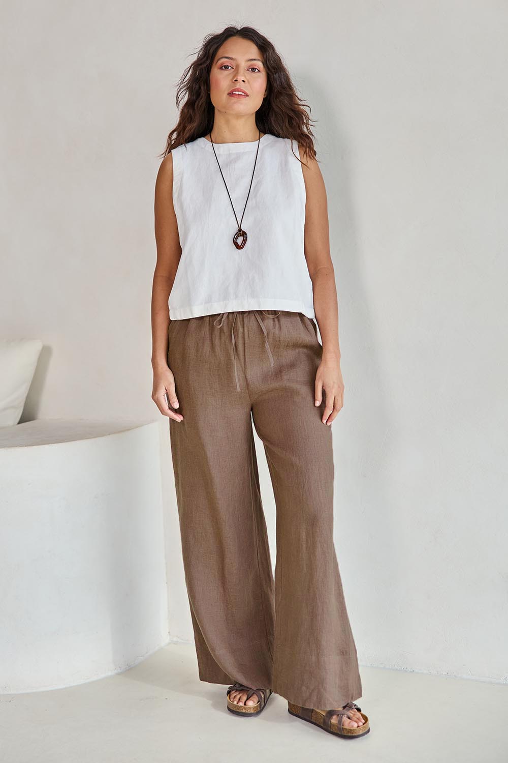 Model Tahneei wearing size 10 of the Linen Drawstring Pant – Coffee in colour Coffee, from the front