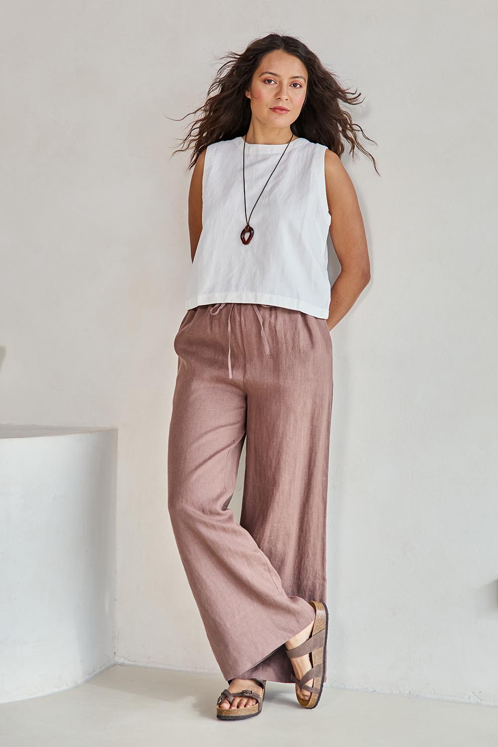 Model Tahneei wearing size 10 of the Linen Drawstring Pant – Coffee in colour Coffee, from the front