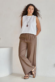 Model Tahneei wearing size 10 of the Linen Drawstring Pant – Coffee in colour Coffee, from the front