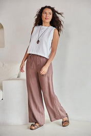 Model Tahneei wearing size 10 of the Linen Drawstring Pant – Coffee in colour Coffee, from the front