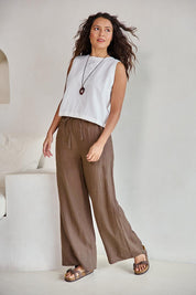 Model Tahneei wearing size 10 of the Linen Drawstring Pant – Coffee in colour Coffee, from the front