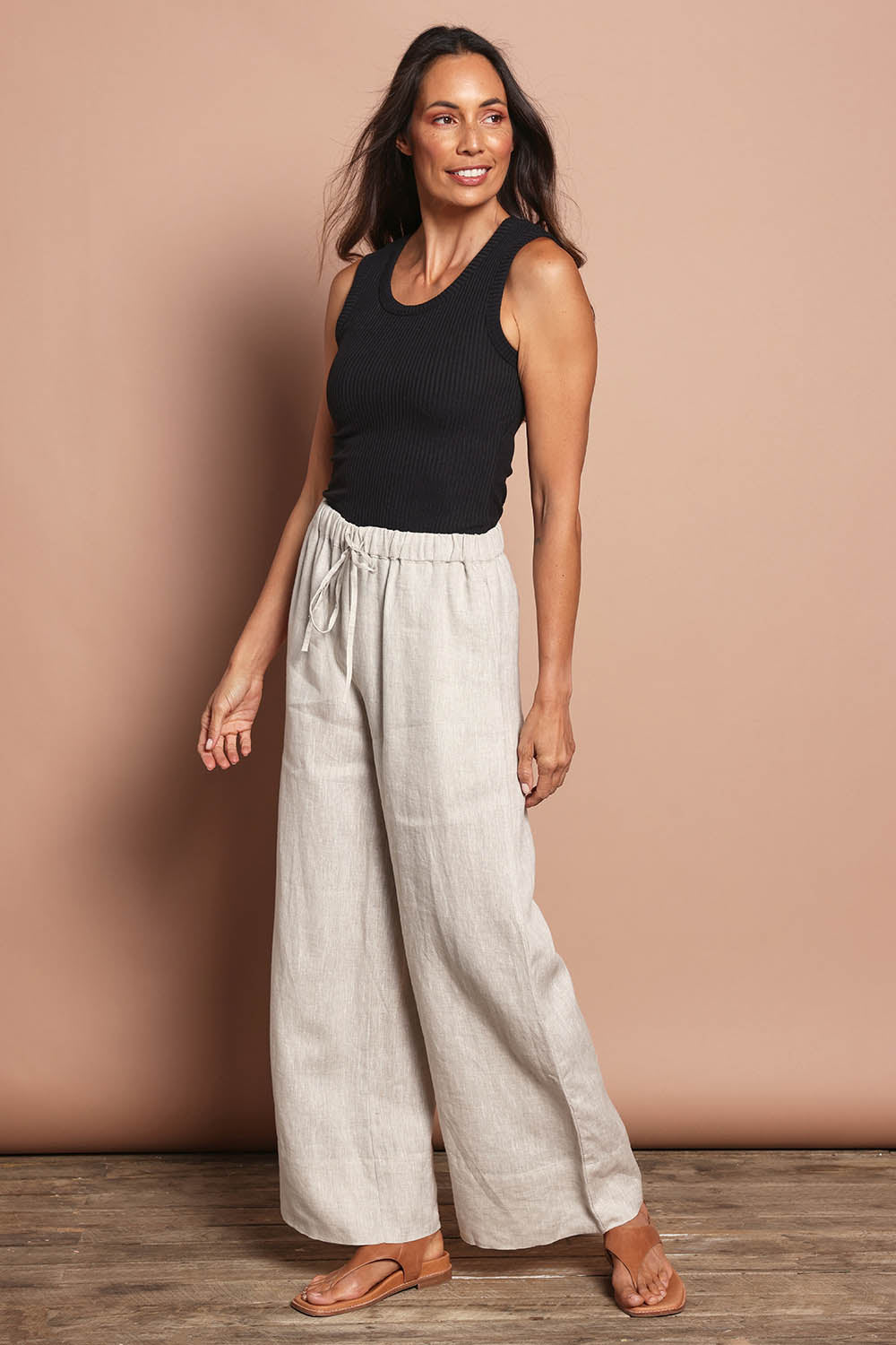 Model Amanda wearing size 10 of the Linen Drawstring Pant in colour Natural, from the front, showing the whole outfit