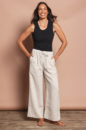 Model Amanda wearing size 10 of the Linen Drawstring Pant in colour Natural, from the front, showing the whole outfit