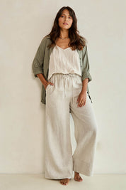 Model Tahnee wearing size 10 of the Linen Drawstring Pant in colour Natural, from the front, showing the whole outfit