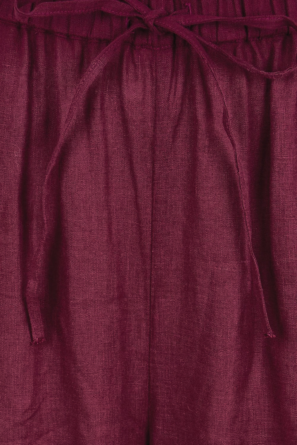 Product shot of the Linen Drawstring Pant – Plum in colour Plum, showing detail