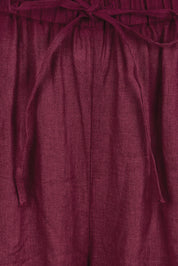 Product shot of the Linen Drawstring Pant – Plum in colour Plum, showing detail