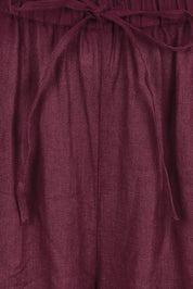 Product shot of the Linen Drawstring Pant – Plum in colour Plum, showing detail