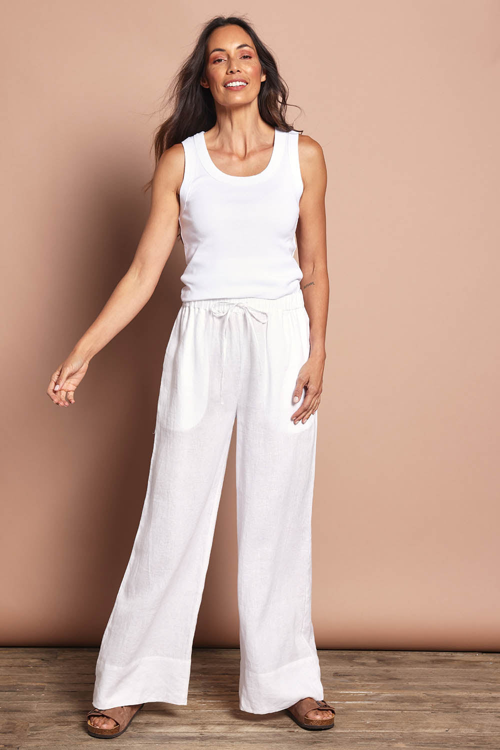 Model Amanda wearing size 10 of the Linen Drawstring Pant in colour White (White), from the front, showing the whole outfit