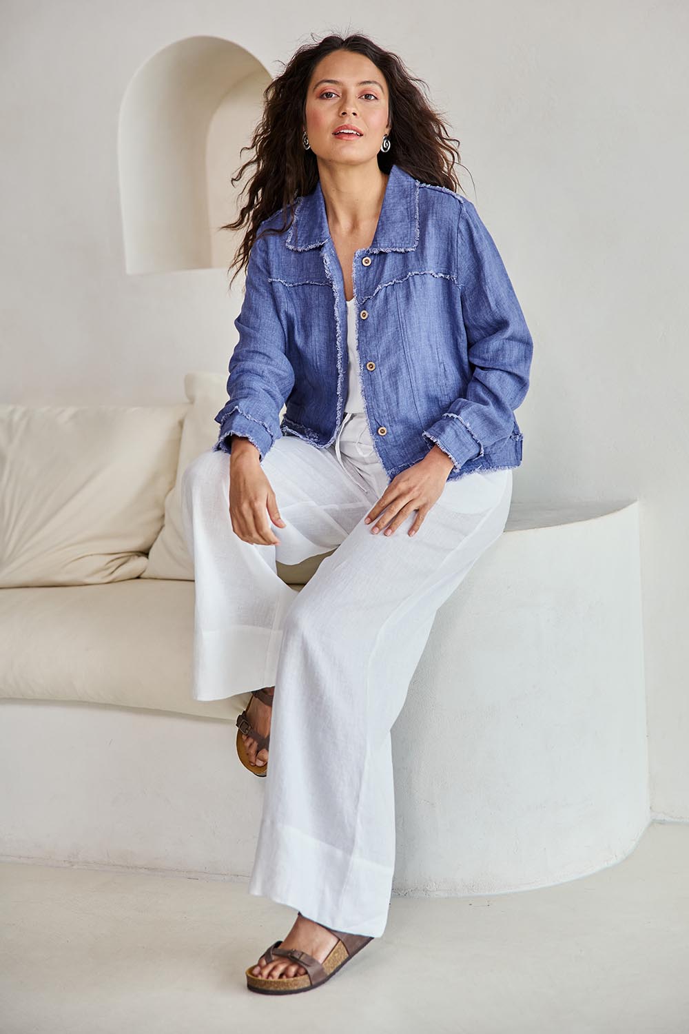 Model Tahneei wearing size 10 of the Linen Relaxed Jacket – Denim in colour Denim, from the front
