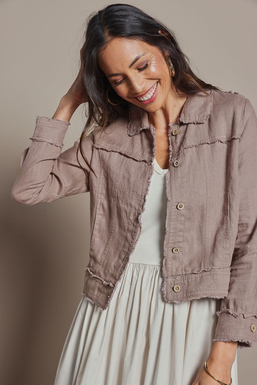 Model Amanda wearing size 10 of the Linen Relaxed Jacket in colour Latte, from the front, cropped image