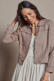 Model Amanda wearing size 10 of the Linen Relaxed Jacket in colour Latte, from the front, cropped image