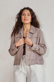 Model Tahneei wearing size 10 of the Linen Relaxed Jacket – Latte in colour Latte, from an angle