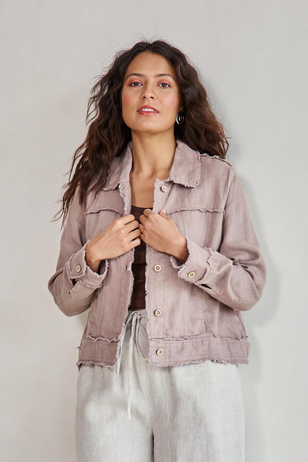 Model Tahneei wearing size 10 of the Linen Relaxed Jacket – Latte in colour Latte, in a cropped view