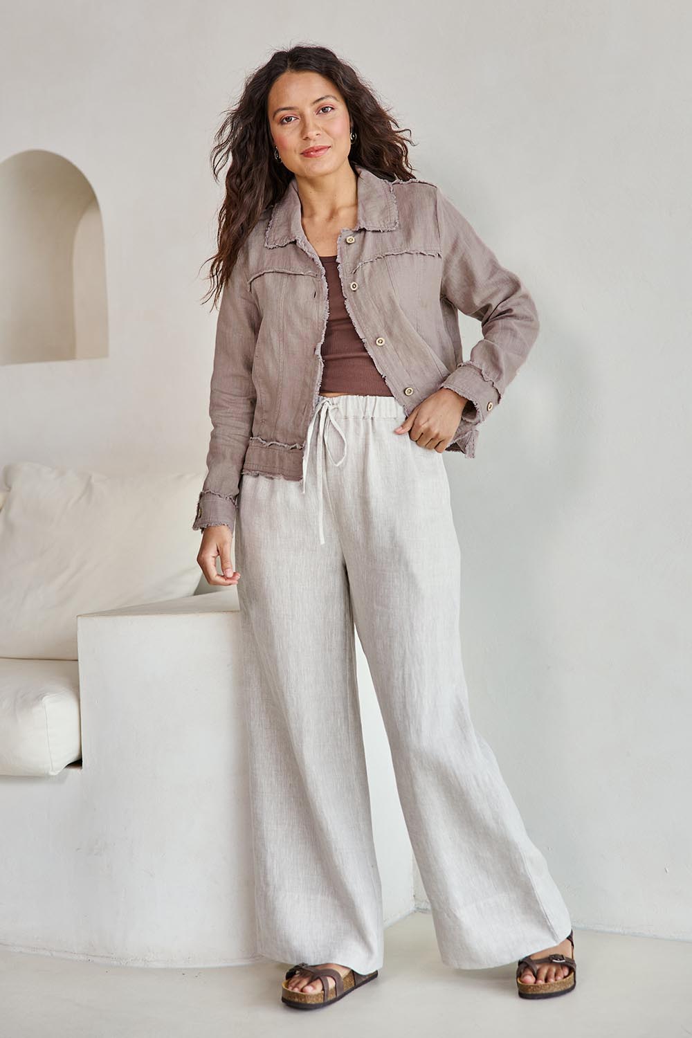 Model Tahneei wearing size 10 of the Linen Relaxed Jacket – Latte in colour Latte, from the front