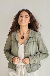 Model Tahneei wearing size 10 of the Linen Relaxed Jacket – Olive in colour Olive, in a cropped view