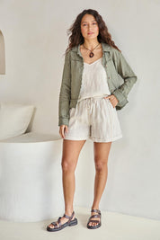 Model Tahneei wearing size 10 of the Linen Relaxed Jacket – Olive in colour Olive, from the front