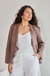 Model Tahneei wearing size 10 of the Linen Draped Jacket – Coffee in colour Coffee, from an angle