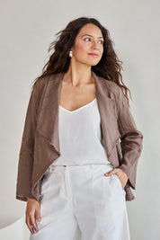 Model Tahneei wearing size 10 of the Linen Draped Jacket – Coffee in colour Coffee, from an angle
