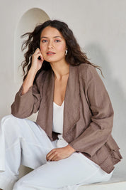 Model Tahneei wearing size 10 of the Linen Draped Jacket – Coffee in colour Coffee, in a cropped view