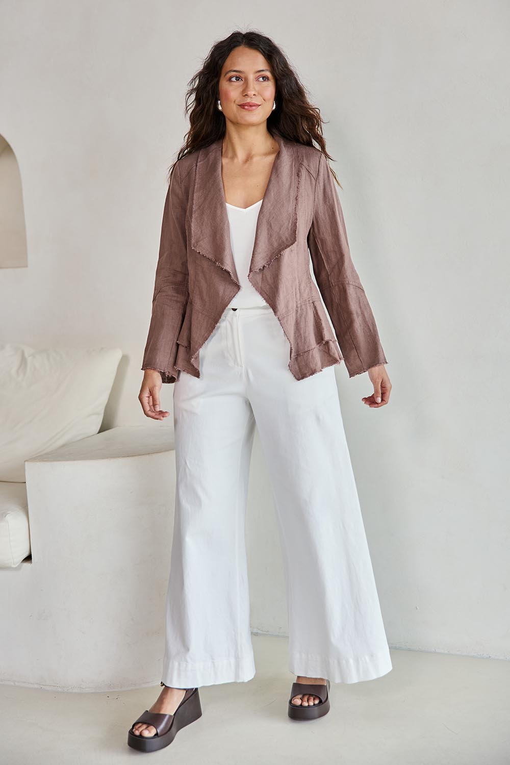 Model Tahneei wearing size 10 of the Linen Draped Jacket – Coffee in colour Coffee, from the front
