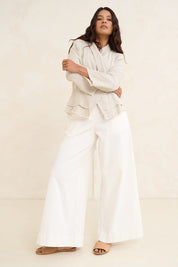 Model Tahnee wearing size 10 of the Linen Draped Jacket in colour Natural, from the front, showing the whole outfit