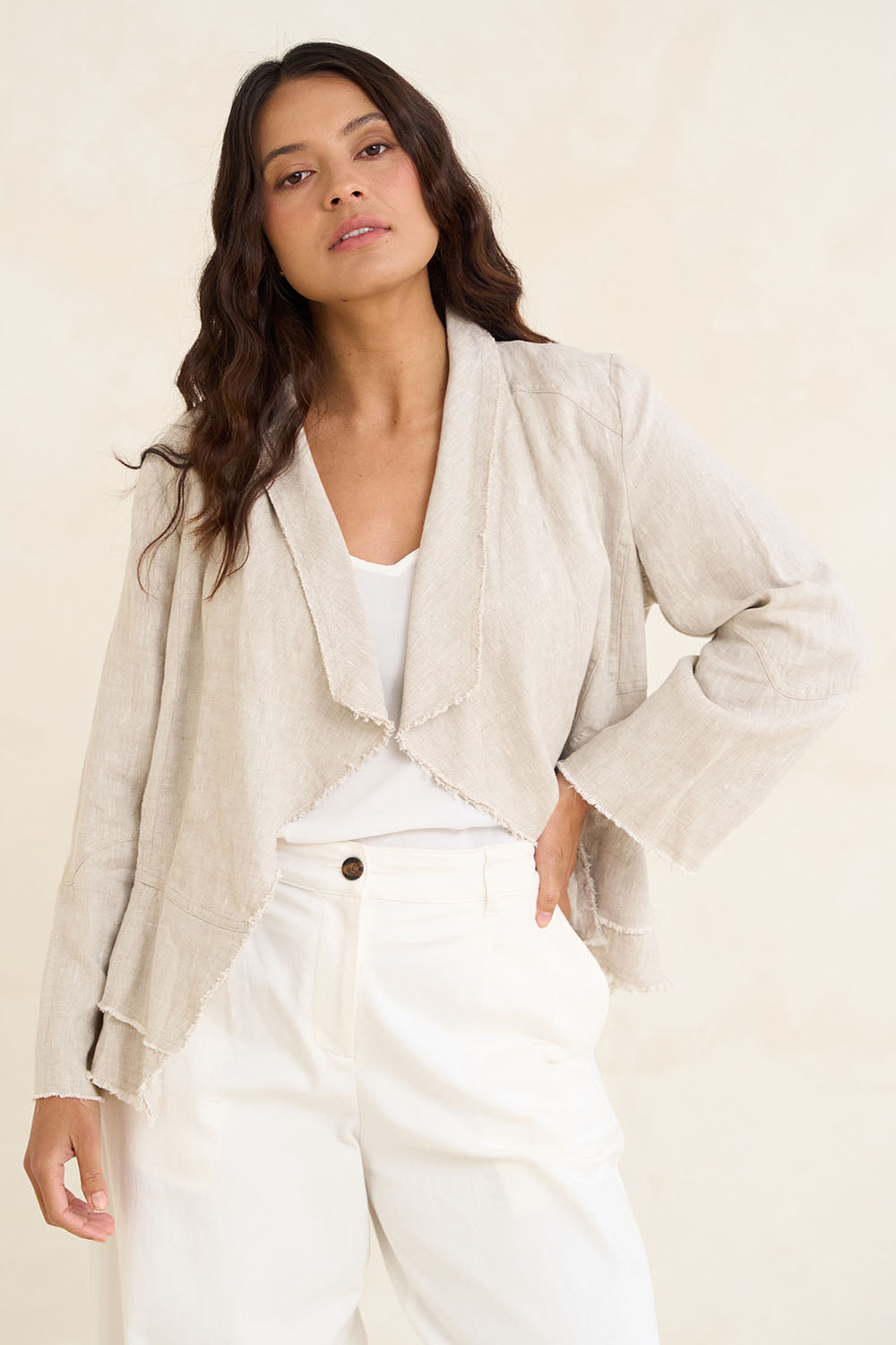 Model Tahnee wearing size 10 of the Linen Draped Jacket in colour Natural, from the front, showing the whole outfit