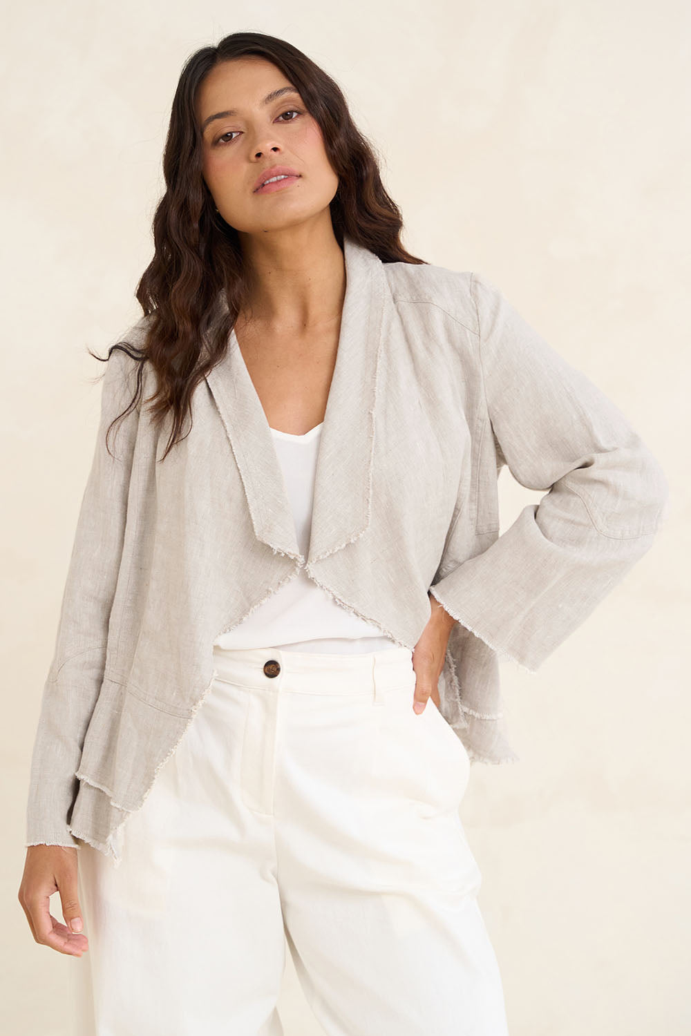 Model Tahneei wearing size 10 of the Linen Draped Jacket – Natural in colour Natural, in a cropped view