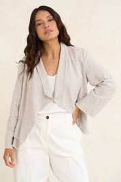 Model Tahneei wearing size 10 of the Linen Draped Jacket – Natural in colour Natural, in a cropped view