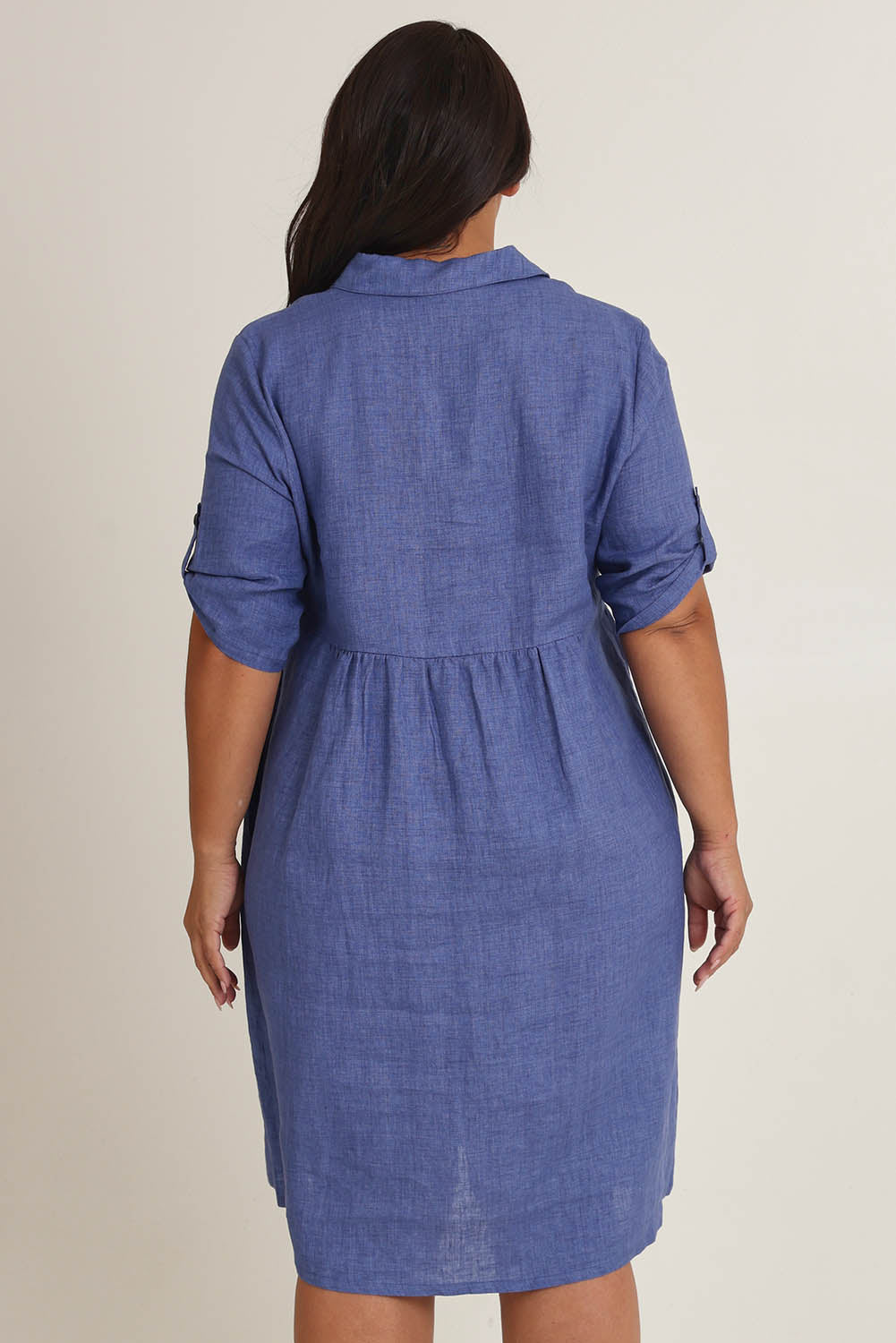Model Ashleigh wearing size 16 of the Linen Shirt Maker Dress in colour Denim (Blue), from the back