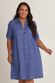 Model Ashleigh wearing size 16 of the Linen Shirt Maker Dress in colour Denim (Blue), from the front, cropped image