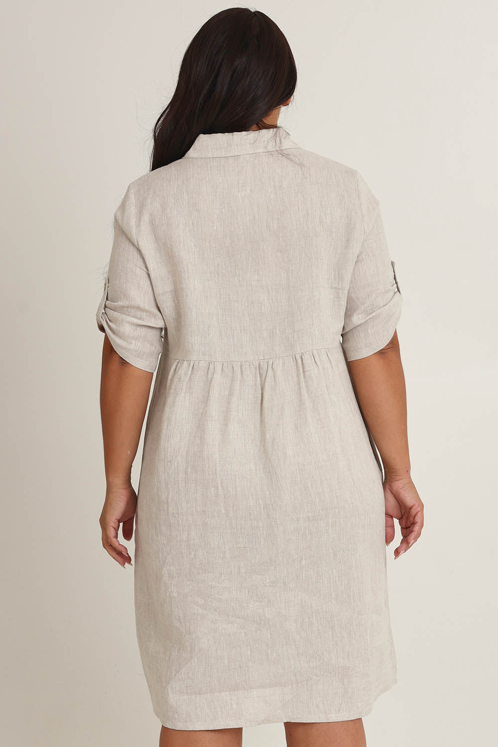 Model Ashleigh wearing size 16 of the Linen Shirt Maker Dress in colour Natural, from the back