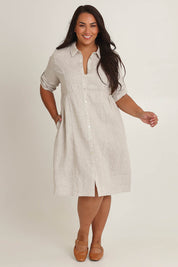 Model Ashleigh wearing size 16 of the Linen Shirt Maker Dress in colour Natural, from the front, showing the whole outfit