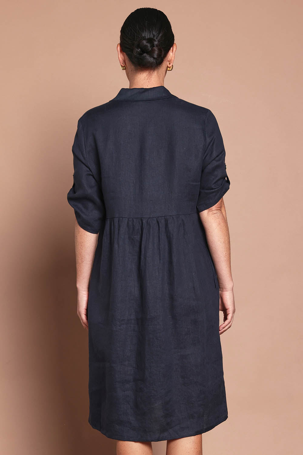 Model Katie wearing size 10 of the Linen Shirt Maker Dress in colour Navy (Blue), from the back