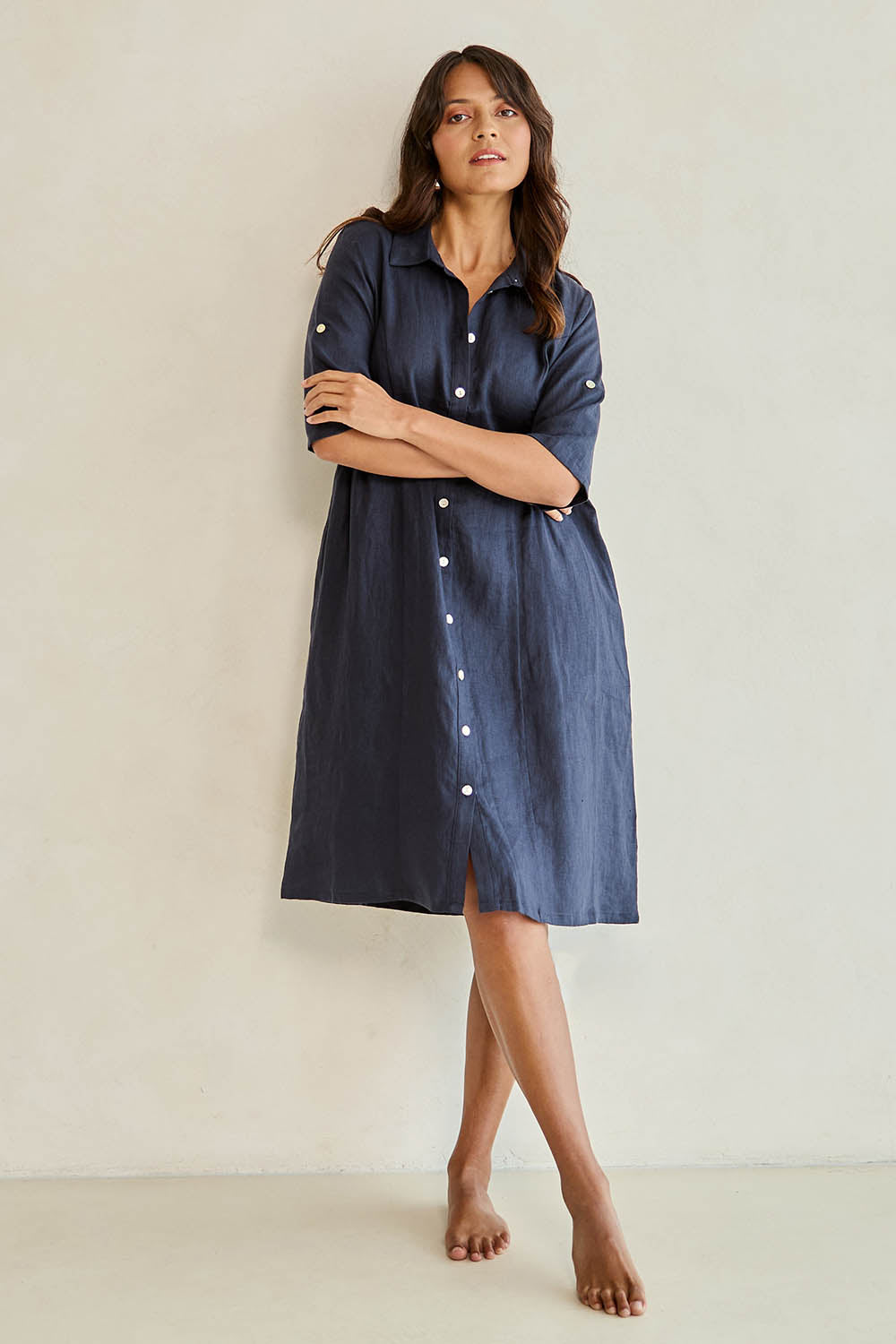 Model Tahnee wearing size 10 of the Linen Shirt Maker Dress in colour Navy (Blue), from the front, cropped image