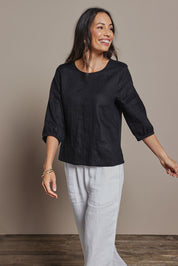 Model Amanda wearing size 10 of the Linen 3/4 Sleeve Top in colour Black (Black), from the front, cropped image