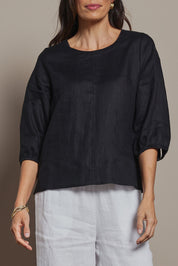 Model Amanda wearing size 10 of the Linen 3/4 Sleeve Top in colour Black (Black), from the front, cropped image