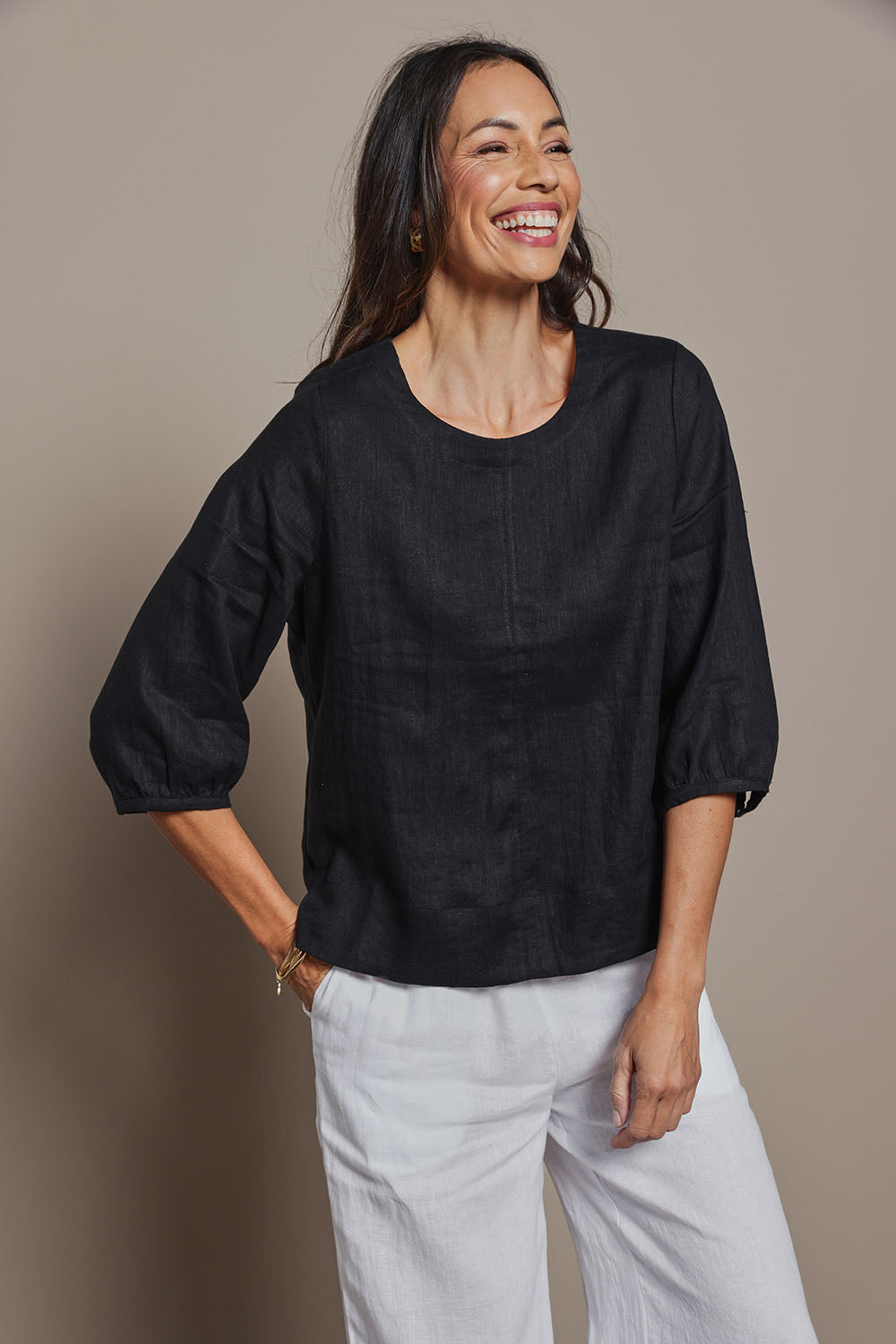 Model Amanda wearing size 10 of the Linen 3/4 Sleeve Top in colour Black (Black), from the front, cropped image